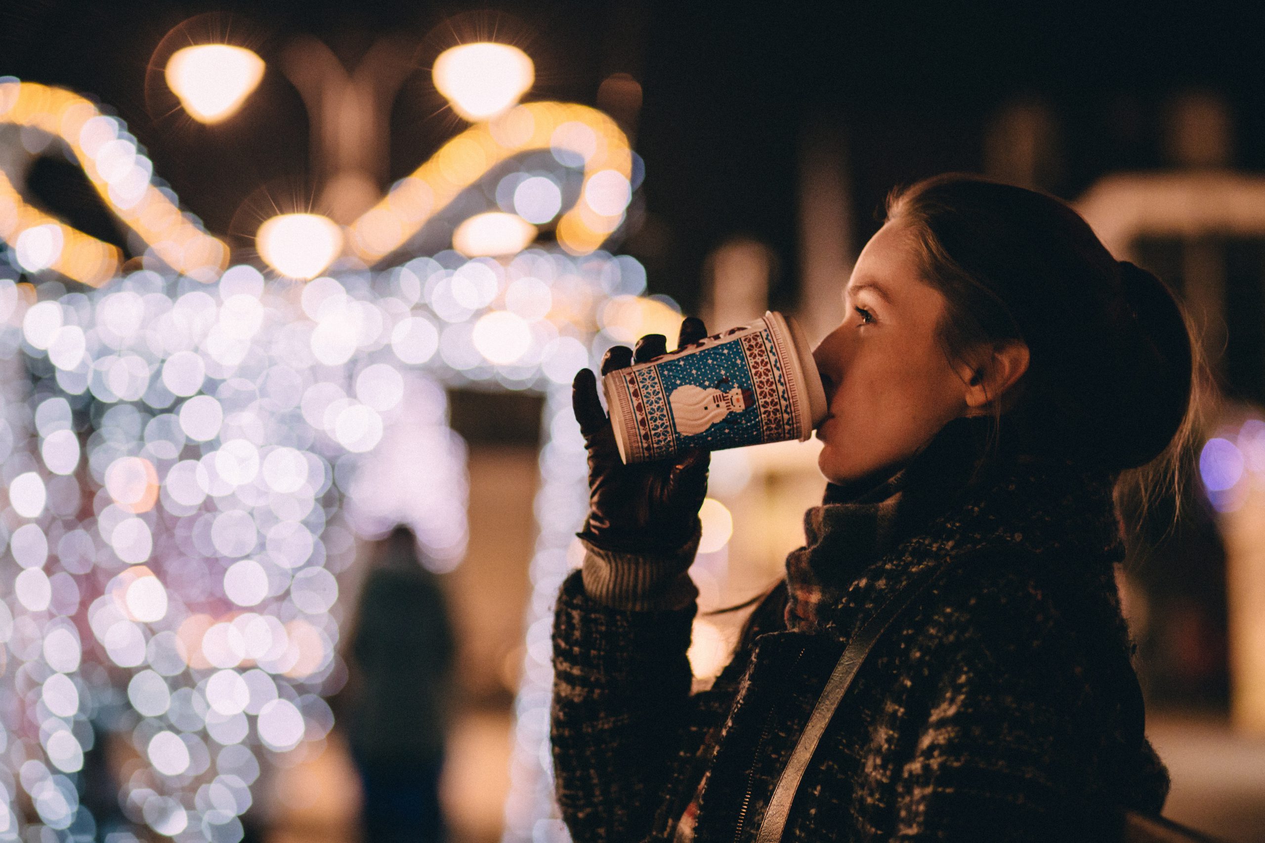 a woman drinking coffee during the holidays