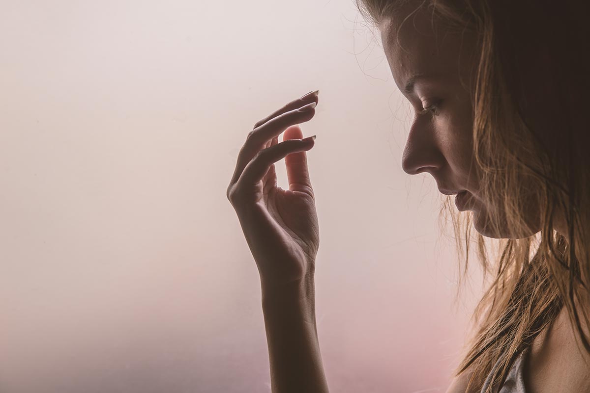 lighthousetreatment-photo-the-silhouette-of-stressed-and-depressed-woman-sad-girl-near-window-thinking-about-something-737152426