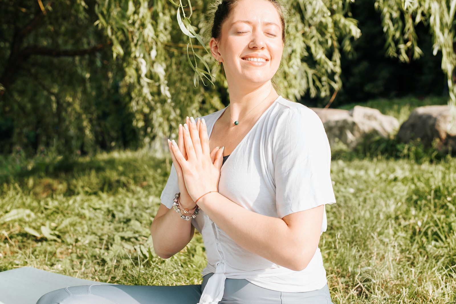 Close-up Portrait Of Happy Smiling Young Woman Practicing Medita