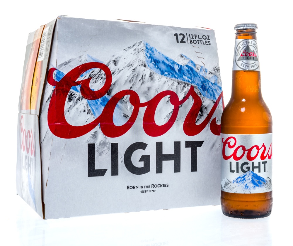 One bottle of Coors Light beer in front of a 12-pack Coors Light pack