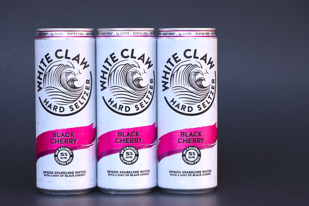 Three cans of White Claw hard seltzer Black Cherry flavor