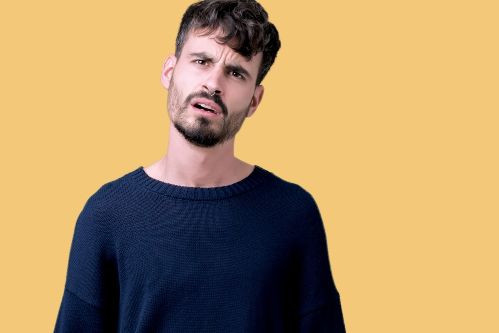 Man with a questioning look on his face about cocaine